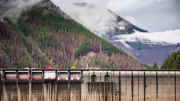 Construction equipment atop a hydroelectric dam