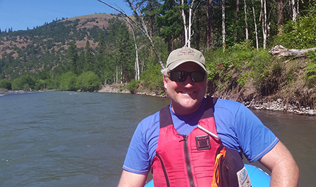 picture of Sean Welch in boat in water on a sunny day
