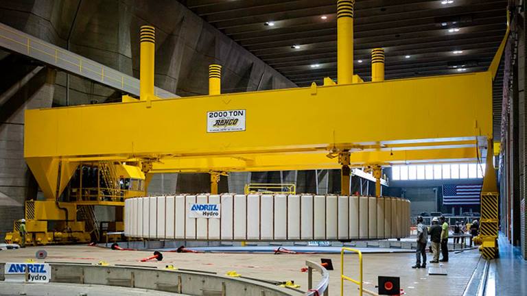 The 2,000 ton Rahco crane—the only one of its kind in the world  – was used to reinstall a refurbished rotor in a hydroelectric generator at Grand Coulee Dam. A recent project to refurbish turbine mechanical components in three 805 MW hydroelectric generators restored the units’ overall condition and increased their reliability. Photo by Bureau of Reclamation