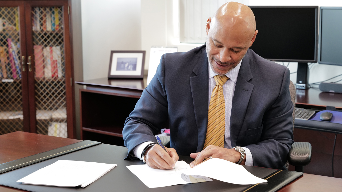 BPA Administrator and CEO John Hairston signing Western Resource Adequacy Program closeout letter